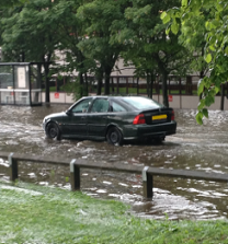 Photograph of a flooded road in Newcastle upon Tyne, 2012